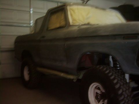 1978 Ford Bronco - This 1978 Ford Bronco is undergoing preparation for painting, with its windows covered.