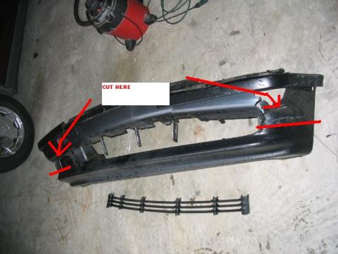 1995 Ford Taurus - A damaged front bumper part is shown with red arrows pointing to areas for cutting and repair.