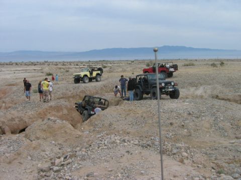 1985 Ford Bronco - Off-road enthusiasts tackle challenging desert trails with their Jeeps.