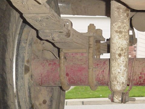 1987 Ford Bronco - offset setup, .25" plate with whole for leaf centerpin to drop into, then another whole with a 5/8 rod used to center into the axle, along…