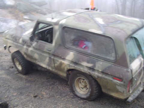 1993 Ford Bronco - This camouflaged SUV is viewed from the front-three-quarter angle, showing its exterior.