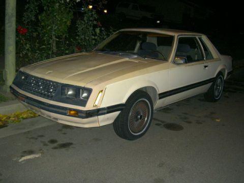 1982 Ford Mustang - This 1982 Ford Mustang coupe features a distinctive black grille and chrome accents, captured in a three-quarter front view.