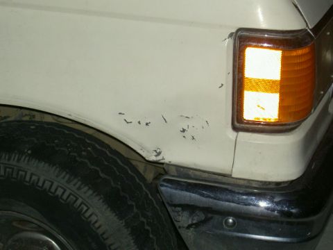 1988 Ford Bronco - My Messed Up Fender. You can't see all that well but it bows in about an inch there.