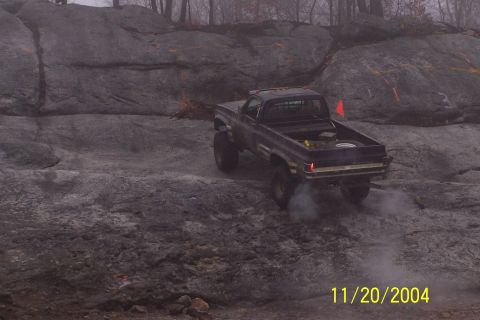1979 Ford Bronco - Pickup truck navigating a challenging rocky off-road course.