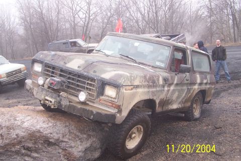 1979 Ford Bronco - This Ford Bronco is navigating a rocky obstacle course with other vehicles present.