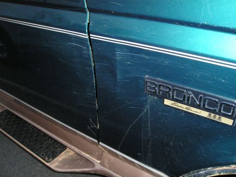 1996 Ford Bronco - Scratched door panel on a 1996 Ford Bronco Eddie Bauer.