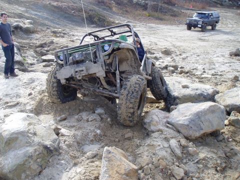 1992 Ford Bronco - Off-road vehicles tackle a challenging rocky course.