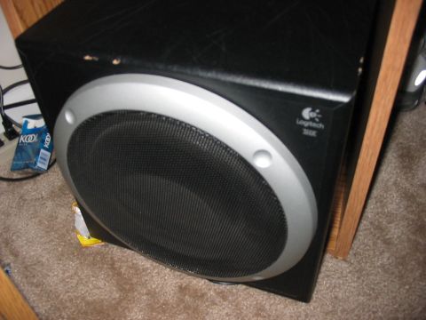 1988 Ford Bronco - Logitech 30K speaker shown up close on a carpeted floor.