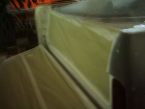 1978 Ford Bronco - Vehicle interior covered with protective material, possibly during restoration or transport.
