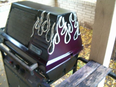 1996 Ford Bronco - A gas grill with custom flame decals is shown outdoors next to a wooden bench.