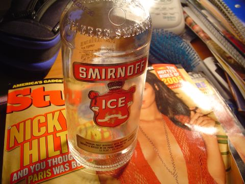 1990 Ford Bronco - A Smirnoff Ice bottle rests on a stack of magazines, including one about 2005 rides.