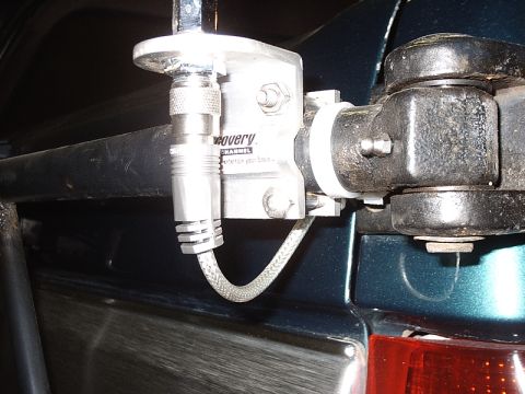 1996 Ford Bronco - Close-up of a CB antenna mount with 'Discovery Channel' branding on a vehicle's rear exterior.