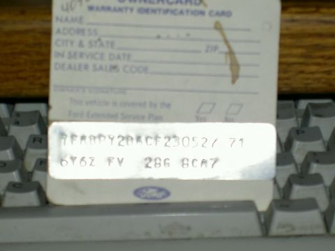 1982 Ford Mustang - A close-up of a Ford warranty identification card shows vehicle details and a VIN.