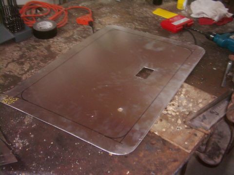 1978 Ford Bronco - Metal panel being worked on in a workshop, possibly a custom part.