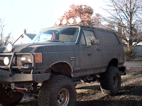 1990 Ford Bronco - Isn't she shiny? Second mudidng trip. We had to open the doors to turn coming into town b/c mudd was blocking our view out side windows.
