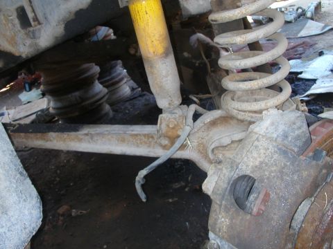 1993 Ford Bronco - The image shows the suspension and braking system of a vehicle, focusing on the front axle components.