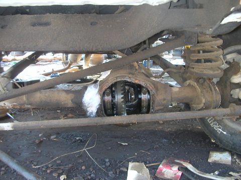 1993 Ford Bronco - Close-up view of a vehicle's rear differential and suspension system.
