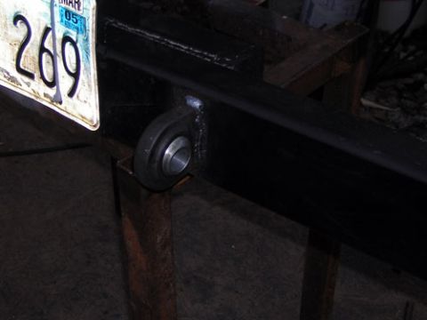 1995 Ford Bronco - License plate attached to a vehicle frame part, possibly for a trailer or custom build.