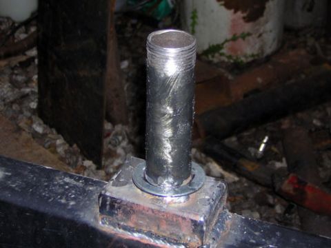 1995 Ford Bronco - Close-up of a threaded metal pipe mounted on a welded metal frame, likely part of a custom build or aftermarket modification.
