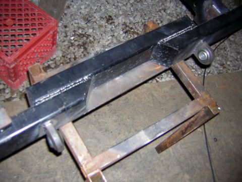 1995 Ford Bronco - Close-up of a welded metal frame section, possibly part of a vehicle chassis or custom fabrication.