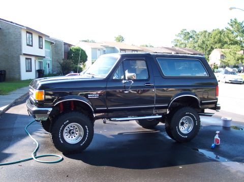 1989 Ford Bronco - Black 1989 Ford Bronco with lifted suspension and off-road tires.