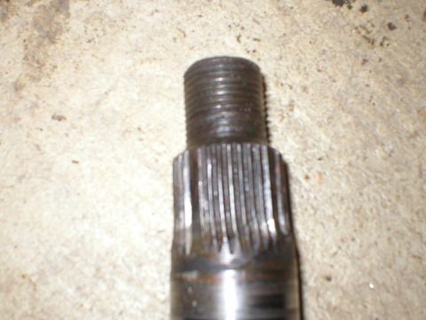 1978 Ford Bronco - This image shows a close-up of a splined shaft with a threaded end, likely a mechanical component.
