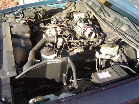 1999 Ford Crown Victoria - September 26, 2004 Side view of throttle bdy spacer and heat shield installed.