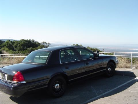 1999 Ford Crown Victoria - August 28, 2004 Passenger side rear view of the P71 and the view from the Vista Point along Skyline.