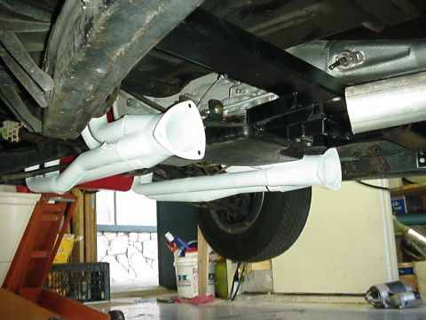 1958 Ford Custom Coupe - Underside view of a vehicle's exhaust system, showing headers and pipes.