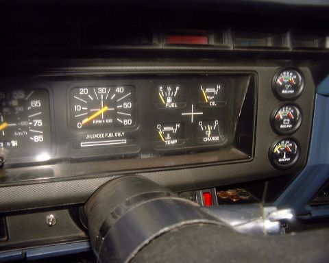 1985 Ford F-150 - The dashboard displays various gauges including speed, RPM, fuel, oil, temperature, and charging status, along with additional aftermarket…