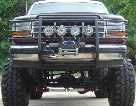 1993 Ford Bronco - This lifted Ford truck features a heavy-duty brushguard and winch, ready for off-road adventures.