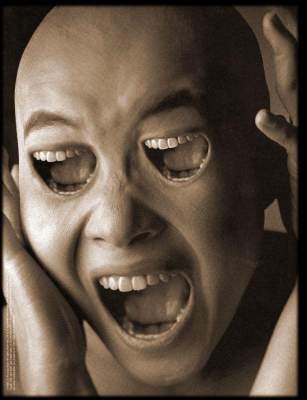 2003 Jeep TJ - Disturbing surreal artwork depicts a screaming face with mouths for eyes.