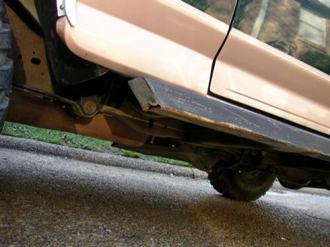 1995 Ford Bronco - Underside view of a 1995 Ford Bronco, highlighting the running board and suspension components.