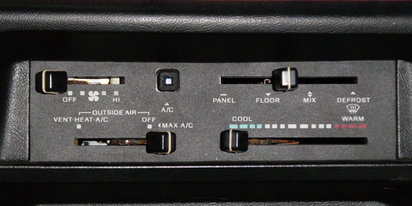 Black HVAC climate control panel with sliders for fan, mode, and COOL-WARM temperature