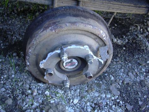 1978 Ford Bronco - Close-up of a damaged wheel hub and brake drum, showing signs of wear and tear.