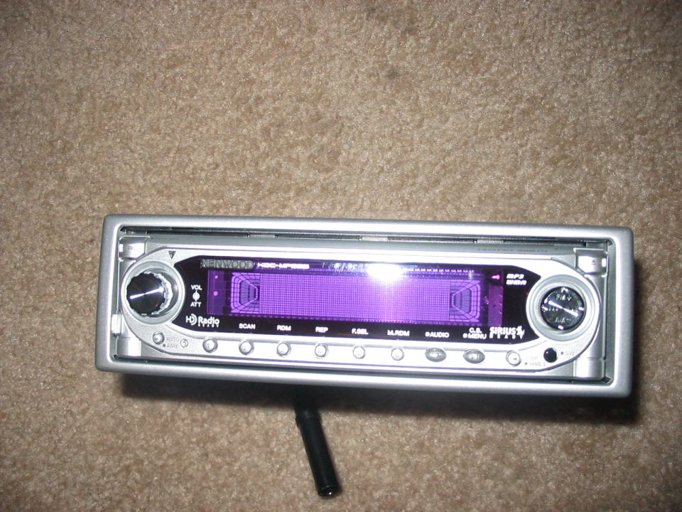 Silver car stereo with purple display