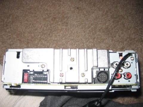 1988 Ford Bronco - The rear of a car stereo unit displays its connection ports and a 10A fuse.
