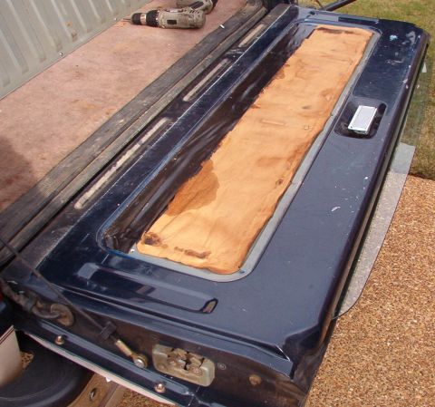 1983 Ford Bronco - The wetness on the moisture barrier shows that the weatherbelts are dry-rotted & should be replaced before they scratch the heater grid or…
