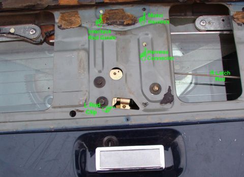 1983 Ford Bronco - If the glass is clear of the shell, but you can't open the t/g, remove the inside access panel & pull the 2 rods inward (the L rod is obscu…