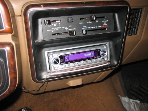 1988 Ford Bronco - Interior view of a car's dashboard, highlighting the car stereo and climate control panel.
