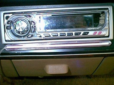 1988 Ford Bronco - A Kenwood car stereo is installed in the dashboard, showing its digital display and control buttons.