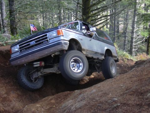 1991 Ford Bronco - Tim, in a signature wheelie, on Can Opener