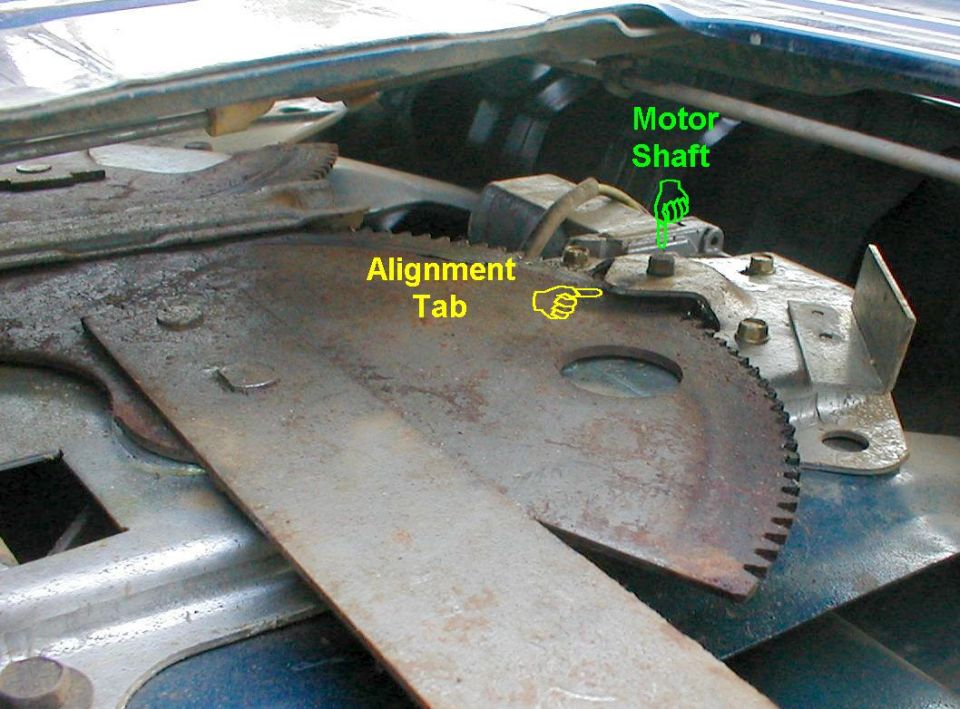 The motor drive's shaft aligns thru the hole in the top of the regulator. If the large gear is popping off the motor gear, bend the small tab down that overhangs the regulator gear to hold it flat against the regulator chassis.  Also, ensure that the motor is mounted properly to the back of the regulator.