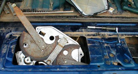 1983 Ford Bronco - The regulator fits out the driver's side. On earlier Broncos, there is a brace here that must be removed. It has 1 phillips screw at the bo…