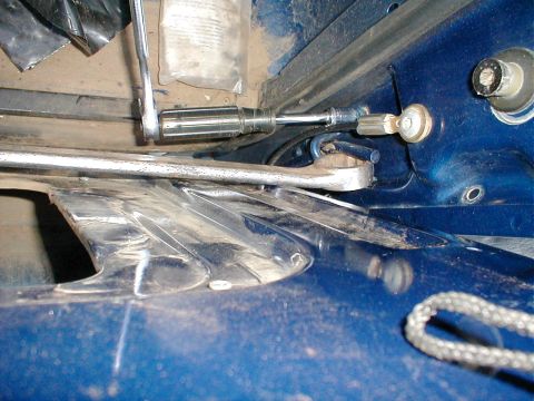 1983 Ford Bronco - Before unbolting the tailgate from its hinges, first relieve the torque rod by bracing it against the tailgate & removing its guide loop fr…