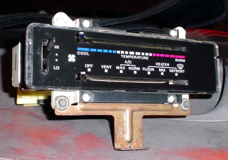 Car climate control panel with temperature, fan speed, and mode selectors. Text includes COOL, WARM, A/C, OFF, VENT, MAX, NORM, FLOOR, MIX, DEFROST
