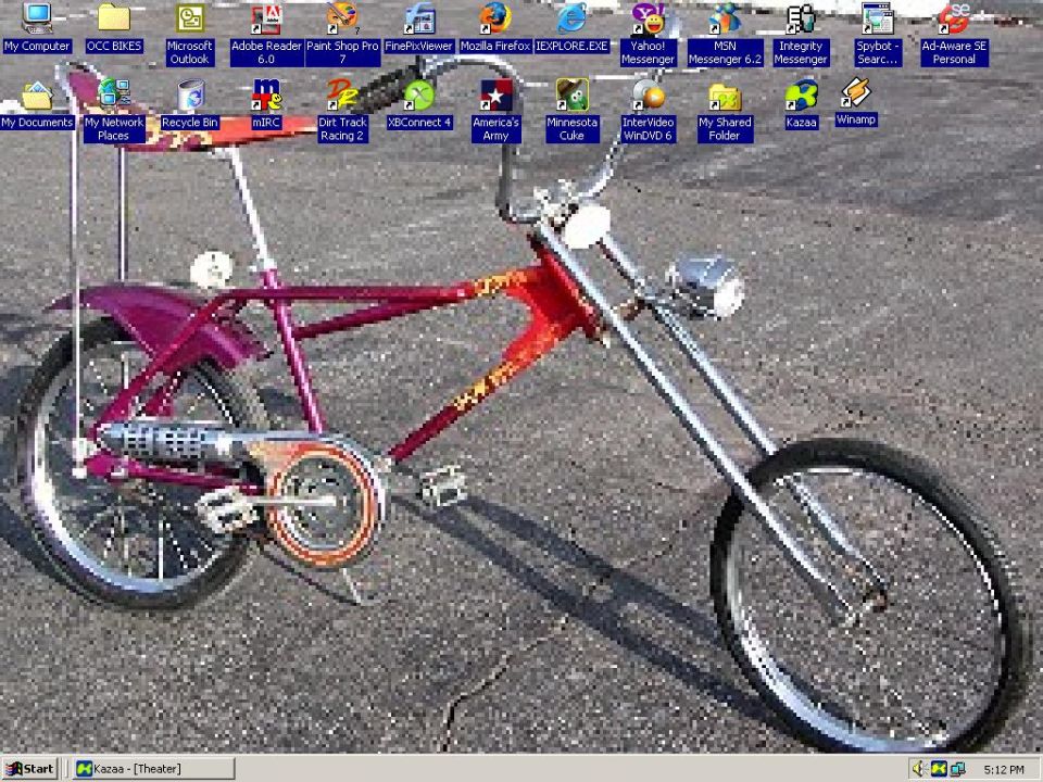 Purple and red chopper bicycle with chrome handlebars and a single headlight
