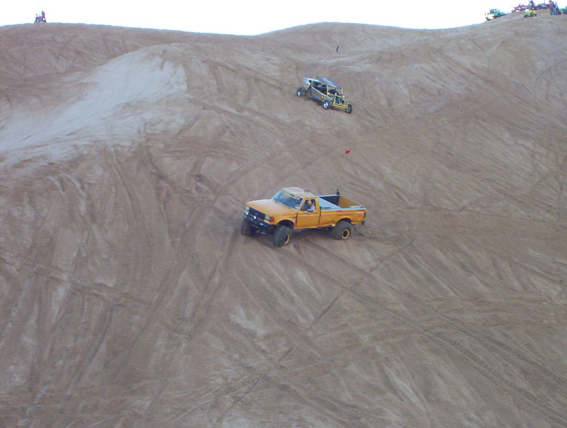 Tiny thumbnail of a single vehicle on tan sand dunes