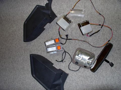 1986 Ford Bronco - Last Friday's junkyard score; 2 crack free seat belt cover panels, 2 Chrysler Fifth Ave dome lights, 2 Lincoln door panel lights, 1 Areosta…