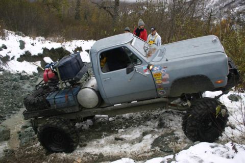 2003 Jeep TJ - Pickup truck modified for off-road use on a challenging snowy and rocky terrain.